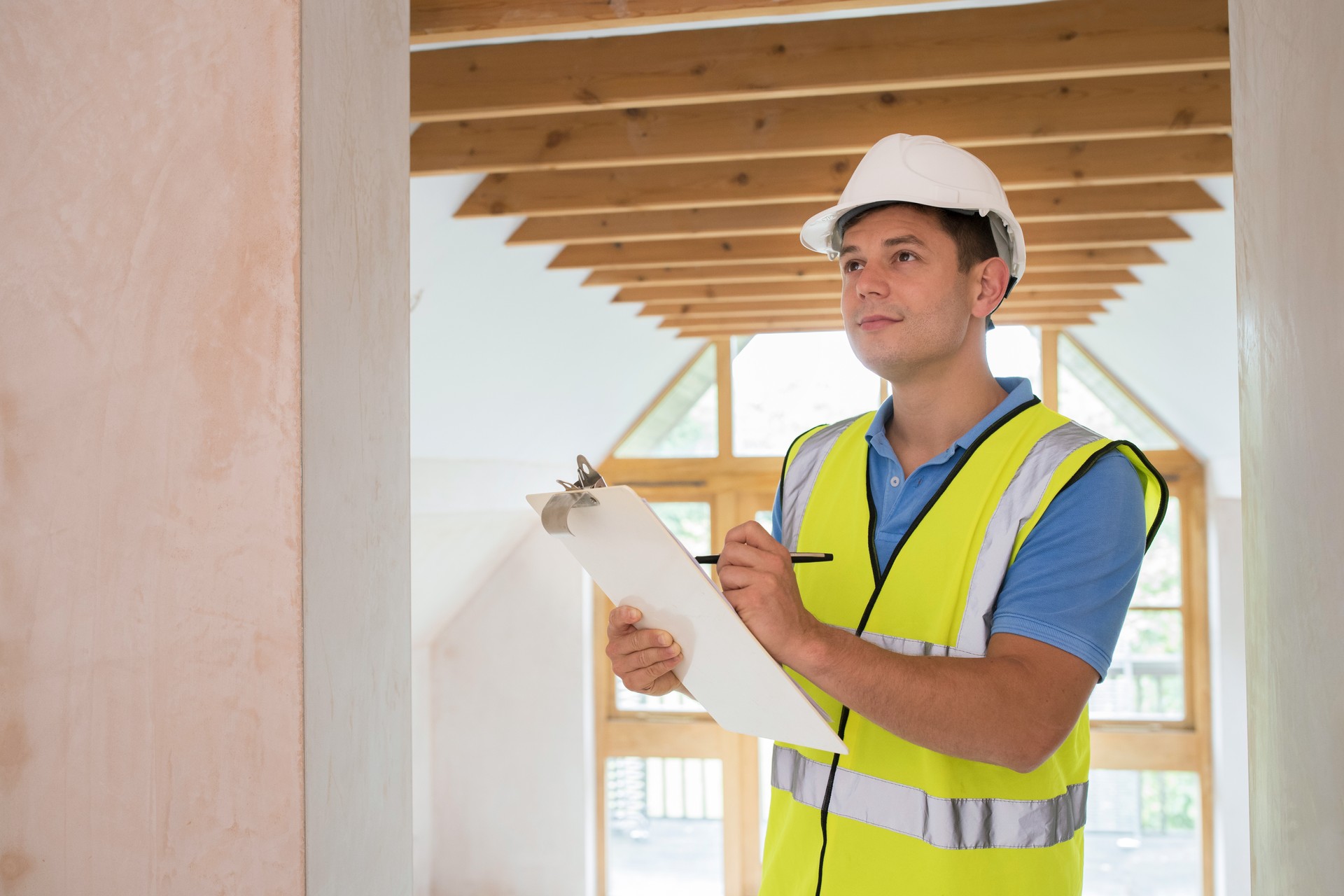 Building Inspector Looking At New Property